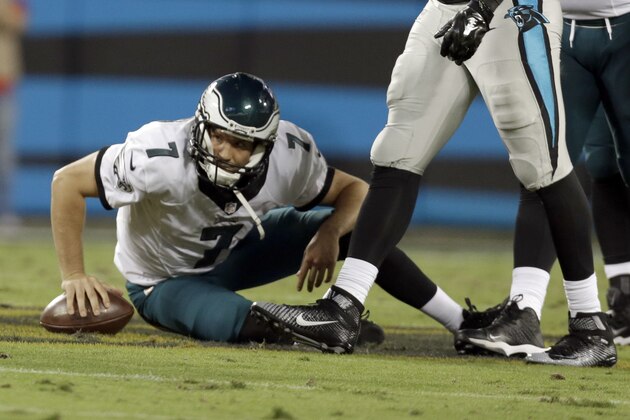 Philadelphia Eagles' Sam Bradford (7) sits on the field after being sacked by the Carolina Panthers in the first half of  an NFL football game in Charlotte, N.C., Sunday, Oct. 25, 2015. (AP Photo/Bob Leverone)
