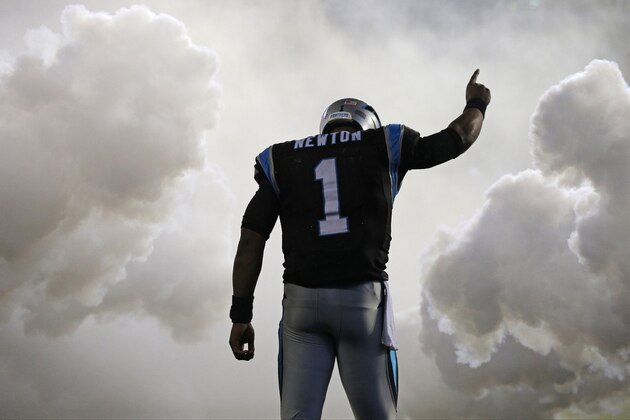 Carolina Panthers' Cam Newton (1) is introduced before an NFL football game against the Indianapolis Colts in Charlotte, N.C., Monday, Nov. 2, 2015. (AP Photo/Chuck Burton)