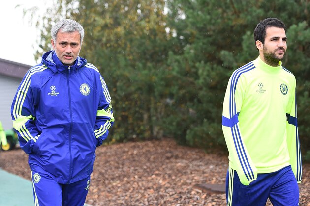 COBHAM, ENGLAND - SEPTEMBER 29:  Manager Jose Mourinho and Cesc Fabregas walks out onto the training pitch during the Chelsea Training Session at Chelsea Training Ground on September 29, 2014 in Cobham, England.  (Photo by Christopher Lee/Getty Images)