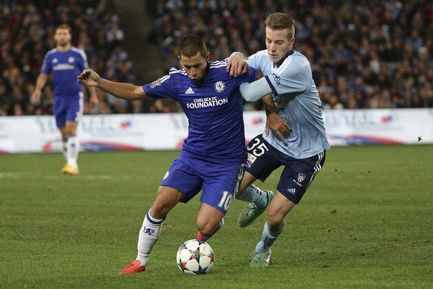 Chelsea F.C. player Eden Hazard, left, and Sydney FC's Andrew Hoote battle for the ball during their club friendly soccer match in Sydney Tuesday, June 2, 2015. (AP Photo/Rob Griffith)