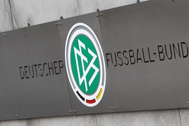 A logo is pictured at the headquarters of the German Football Federation (DFB) in Frankfurt am Main, western Germany, on November 3, 2015. Police raided offices of the German Football Federation (DFB) and homes of top officials over tax evasion allegations, as a scandal surrounding graft claims over the awarding of the 2006 World Cup widened.   AFP PHOTO / DANIEL ROLAND        (Photo credit should read DANIEL ROLAND/AFP/Getty Images)