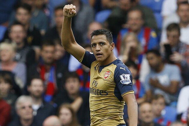 Arsenal's Alexis Sanchez celebrates scoring a goal during the English Premier League soccer match between Arsenal and Crystal Palace at Selhurst Park Stadium in London, Sunday, Aug. 16, 2015. (AP Photo/Kirsty Wigglesworth)