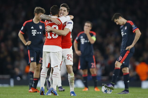 Arsenal's Santi Cazorla, left, and Arsenal's Hector Bellerin celebrate after scoring during the Champions League Group F soccer match between Arsenal and Bayern Munich at Emirates stadium in London Tuesday, Oct. 20, 2015. (AP Photo/Kirsty Wigglesworth)