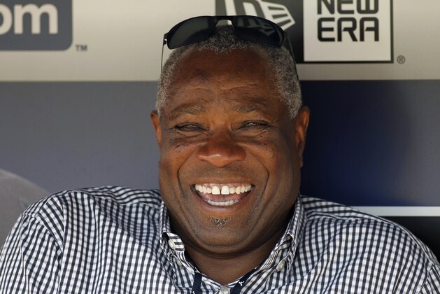 Former manager Dusty Baker sits in the Atlanta Braves dugout before a baseball game against the Miami Marlins, Friday, Aug. 7, 2015, in Atlanta. (AP Photo/Brett Davis)
