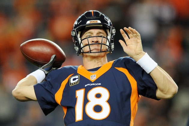 DENVER, CO - NOVEMBER 01:  Quarterback Peyton Manning #18 of the Denver Broncos looks to pass during warm ups before playing against the Greenbay Packers at Sports Authority Field at Mile High on November 1, 2015 in Denver, Colorado.  (Photo by Dustin Bradford/Getty Images)