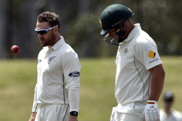 New Zealand's captain Brendon McCullum (L) walks back to his bowling mark during the tour warm-up match between the Cricket Australia XI and New Zealand at Blacktown Sports Park  in Sydney on October 30, 2015. AFP PHOTO / Saeed KHAN
IMAGE STRICTLY RESTRICTED TO EDITORIAL USE - STRICTLY NO COMMERCIAL USE        (Photo credit should read SAEED KHAN/AFP/Getty Images)