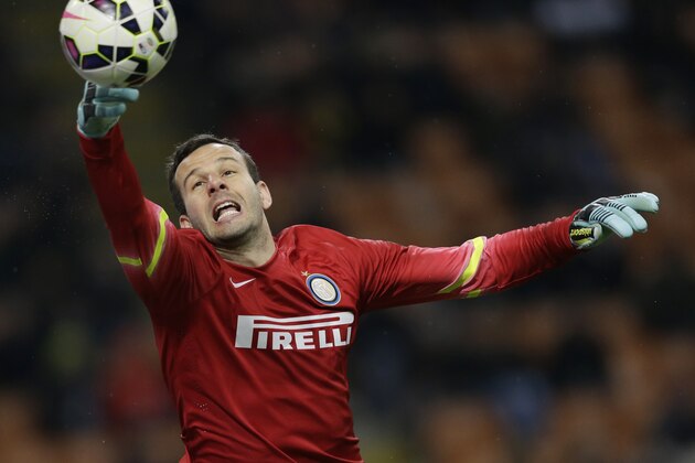 Inter Milan goalkeeper Samir Handanovic saves a ball during a Serie A soccer match between Inter Milan and Cesena, at the San Siro stadium in Milan, Italy, Sunday, March 15, 2015. (AP Photo/Luca Bruno)