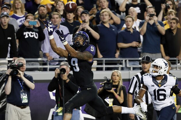TCU wide receiver Josh Doctson (9) reaches up to grab a pass in the end zone for a touchdown in front of West Virginia cornerback Terrell Chestnut (16) in the first half of an NCAA college football game Thursday, Oct. 29, 2015, in Fort Worth, Texas. (AP Photo/Tony Gutierrez) TCU wide receiver Josh Doctson (9) reaches up to grab a pass in the end zone for a touchdown in front of West Virginia cornerback Terrell Chestnut (16) in the first half of an NCAA college football game Thursday, Oct. 29, 2015, in Fort Worth, Texas. (AP Photo/Tony Gutierrez)
