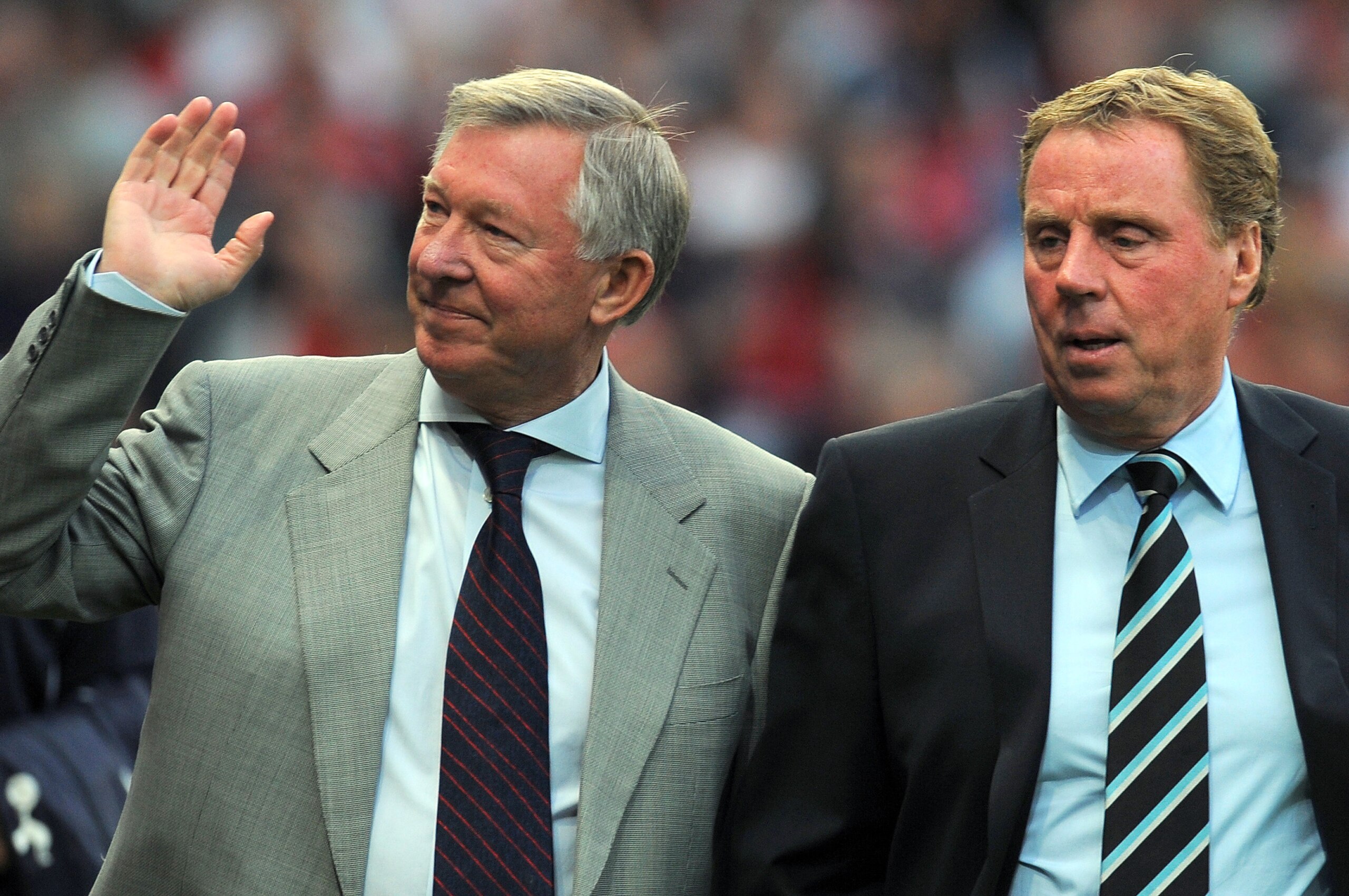Manchester United's manager Alex Ferguson (L) and Tottenham Hotspur's manager Harry Redknapp arrive for the English Premier League football match between Manchester United and Tottenham Hotspur at Old Trafford in Manchester, north west England, on August 22, 2011. AFP PHOTO/ANDREW YATES 
RESTRICTED TO EDITORIAL USE. No use with unauthorized audio, video, data, fixture lists, club/league logos or “live” services. Online in-match use limited to 45 images, no video emulation. No use in betting, games or single club/league/player publications (Photo credit should read ANDREW YATES/AFP/Getty Images)