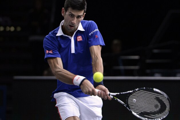 Serbia's Novak Djokovic returns the ball to Brazil's Thomaz Bellucci during their second round tennis match at the ATP World Tour Masters 1000 indoor tennis tournament in Paris on November 3, 2015. AFP PHOTO / MIGUEL MEDINA        (Photo credit should read MIGUEL MEDINA/AFP/Getty Images)