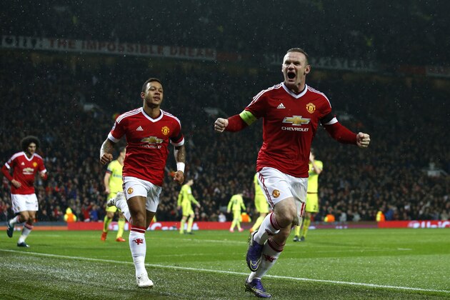 Manchester United's Wayne Rooney celebrates scoring the opening goal during the Champions League Group B soccer match between Manchester United and CSKA Moskva at Old Trafford Stadium, Manchester, England, Tuesday, Nov. 3, 2015. (AP Photo/Jon Super)