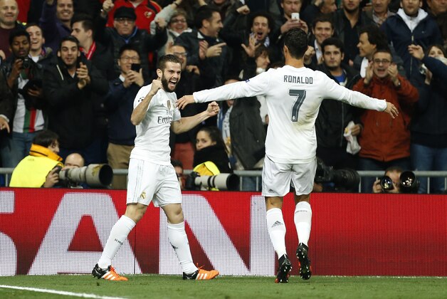 MADRID, SPAIN - NOVEMBER 3: Nacho of Real Madrid celebrates his goal with Cristiano Ronaldo of Real Madrid during the UEFA Champions League match between Real Madrid and Paris Saint-Germain (PSG) at Santiago Bernabeu stadium on November 3, 2015 in Madrid, Spain. (Photo by Jean Catuffe/Getty Images)