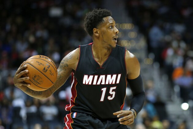 Miami Heat guard Mario Chalmers (15) looks to pass in the second half of a preseason NBA basketball game against the Atlanta Hawks on Sunday, Oct. 18, 2015, in Atlanta. The Heat won the game 101-92. (AP Photo/Todd Kirkland)