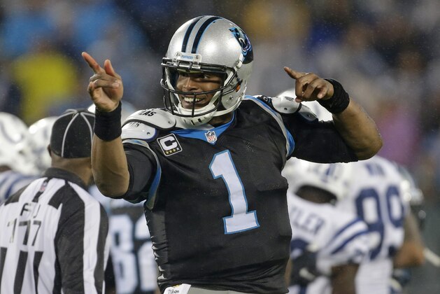 Carolina Panthers' Cam Newton (1) celebrates making a first down against the Indianapolis Colts in the second half of an NFL football game in Charlotte, N.C., Tuesday, Nov. 3, 2015. (AP Photo/Bob Leverone)