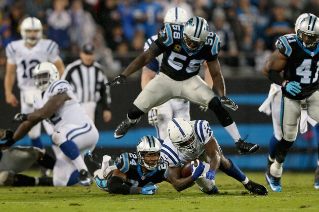 CHARLOTTE, NC - NOVEMBER 02:   Josh Norman #24 and teammate Thomas Davis #58 of the Carolina Panthers tackle Frank Gore #23 of the Indianapolis Colts in the 1st half during their game at Bank of America Stadium on November 2, 2015 in Charlotte, North Carolina.  (Photo by Streeter Lecka/Getty Images)