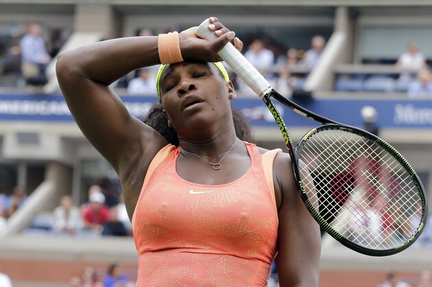 Serena Williams reacts after losing a point to Roberta Vinci, of Italy, during a semifinal match at the U.S. Open tennis tournament, Friday, Sept. 11, 2015, in New York. (AP Photo/Bill Kostroun)