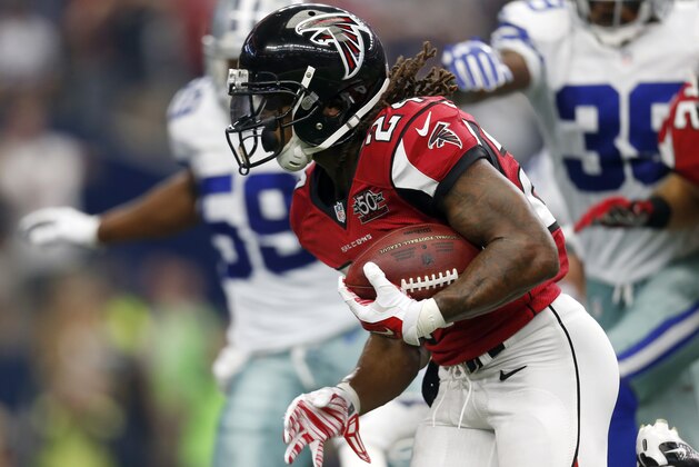 FILE - In this Sept. 27, 2015, file photo, Atlanta Falcons running back Devonta Freeman (24) sprints to the end zone for a touchdown on a running play against the Dallas Cowboys in the first half of an NFL football game on in Arlington, Texas. Atlanta ranks fifth on offense after finding a running game behind Freeman, is second in rushing defense, and shows tons of energy and aggressiveness. (AP Photo/Brandon Wade, File)