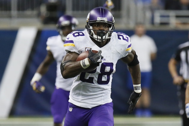 Minnesota Vikings running back Adrian Peterson (28) carries the ball against the Detroit Lions during the second half of an NFL football game, Sunday, Oct. 25, 2015, in Detroit. (AP Photo/Duane Burleson)