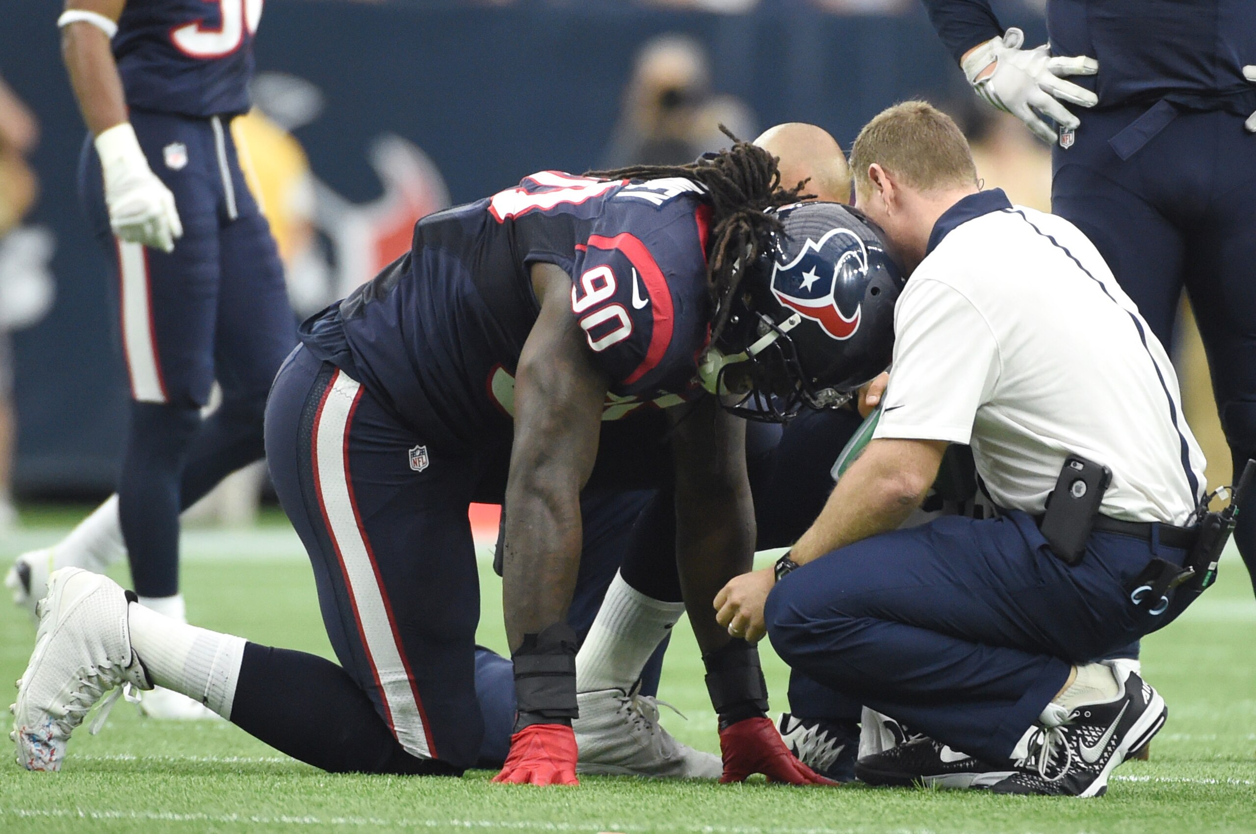Houston Texans outside linebacker Jadeveon Clowney (90) is attended to after he was injured during the first half of an NFL football game against the Tennessee Titans, Sunday, Nov. 1, 2015, in Houston. (AP Photo/Eric Christian Smith)