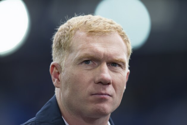 Paul Scholes as a television pundit before the English Premier League soccer match between Everton and Chelsea at Goodison Park Stadium, Liverpool, England, Saturday Sept. 12, 2015. (AP Photo/Jon Super)