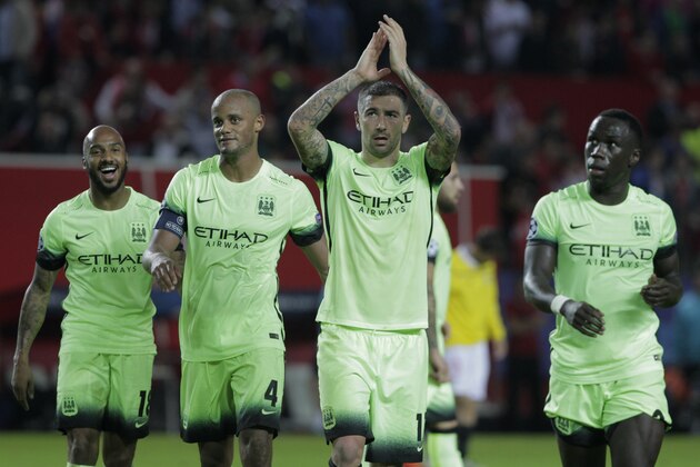 Manchester City team players applaud the fans at the end of the Group D Champions League soccer match between Sevilla and Manchester City at the Ramon Sanchez-Pizjuan stadium in Seville, Spain, Tuesday Nov. 3, 2015. Manchester City won the match 3-1. (AP Photo/Miguel Angel Morenatti)