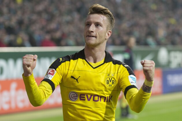 Dortmund's Marco Reus reacts after he scored the third goal for his team during the German Bundesliga soccer match between Werder Bremen and Borussia Dortmund in Bremen, Germany, Saturday, Oct. 31, 2015. (AP Photo/Joerg Sarbach)