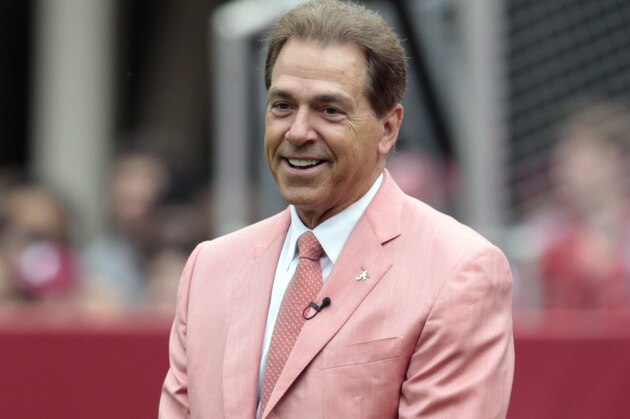 Alabama head coach Nick Saban smiles as he watches  Alabama's spring NCAA college football game, Saturday, April 18, 2015, in Tuscaloosa, Ala. (AP Photo/Butch Dill)