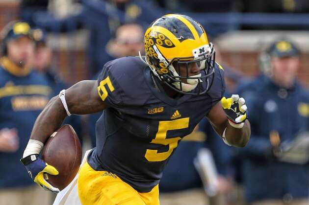 Oct 17, 2015; Ann Arbor, MI, USA; Michigan Wolverines safety Jabrill Peppers (5) runs back a kickoff against the Michigan State Spartans during the1st half of a game at Michigan Stadium. Mandatory Credit: Mike Carter-USA TODAY Sports