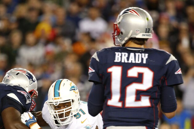 Miami Dolphins defensive end Cameron Wake (91) rushes New England Patriots quarterback Tom Brady during a NFL football game at Gillette Stadium in Foxborough, Mass. Thursday, Oct. 29, 2015. (Winslow Townson/AP Images for Panini)