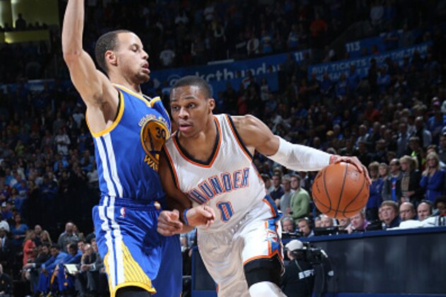 OKLAHOMA CITY, OK- JANUARY 16: Russell Westbrook #0 of the Oklahoma City Thunder drives against Stephen Curry #30 of the Golden State Warriors on January 16, 2015 at Chesapeake Energy Arena in Oklahoma City, OK. NOTE TO USER: User expressly acknowledges and agrees that, by downloading and or using this photograph, User is consenting to the terms and conditions of the Getty Images License Agreement. Mandatory Copyright Notice: Copyright 2015 NBAE (Photo by Layne Murdoch/NBAE via Getty Images)
