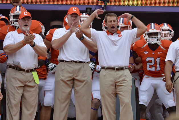Clemson head coach Dabo Swinney, center, urges the fans before the start of an NCAA college football game against Appalachian State Saturday, Sept. 12, 2015, in Clemson, S.C. Clemson won 41-10. (AP Photo/Richard Shiro) Clemson head coach Dabo Swinney, center, urges the fans before the start of an NCAA college football game against Appalachian State Saturday, Sept. 12, 2015, in Clemson, S.C. Clemson won 41-10. (AP Photo/Richard Shiro)