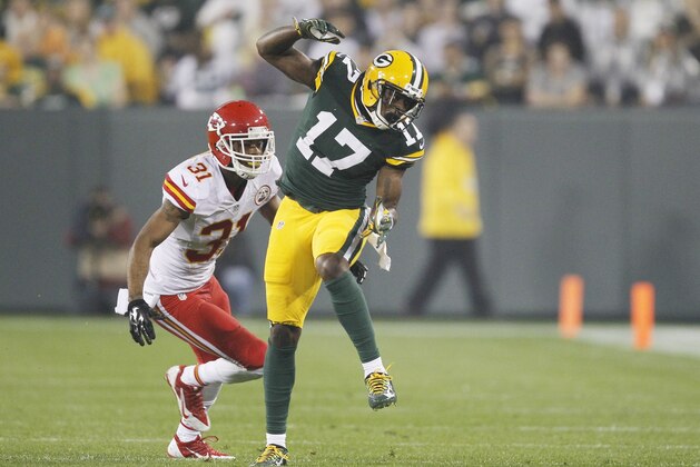 Green Bay Packers' Davante Adams can't catch a ball in front of Kansas City Chiefs' Marcus Cooper during the first half of an NFL football game Monday, Sept. 28, 2015, in Green Bay, Wis. (AP Photo/Matt Ludtke)