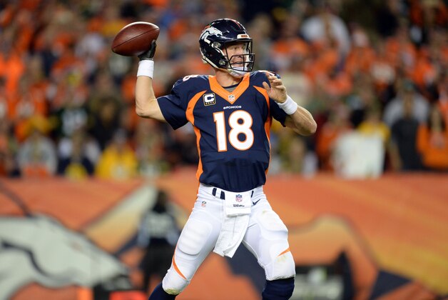 Nov 1, 2015; Denver, CO, USA;  Denver Broncos quarterback Peyton Manning (18) passes the football in the second quarter against the Green Bay Packers at Sports Authority Field at Mile High. Mandatory Credit: Ron Chenoy-USA TODAY Sports