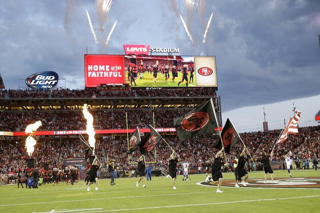 San Francisco 49ers players run onto the field at Levi's Stadium before an NFL football game against the Minnesota Vikings in Santa Clara, Calif., Monday, Sept. 14, 2015. (AP Photo/Marcio Jose Sanchez)