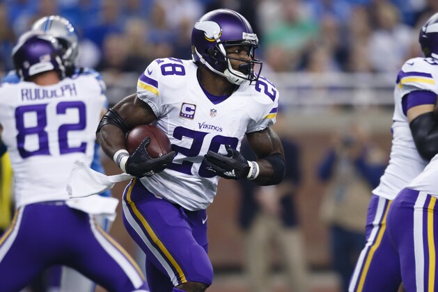 Minnesota Vikings running back Adrian Peterson (28) rushes against the Detroit Lions during an NFL football game, Sunday, Oct. 25, 2015, in Detroit. (AP Photo/Rick Osentoski)