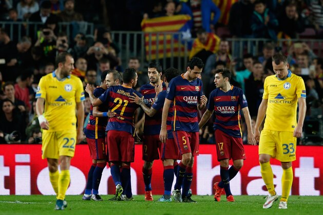 Barcelona's Luis Suarez, center, celebrates after scoring his side’s second goal during the Champions League Group E soccer match between FC Barcelona and BATE Borisov at the Camp Nou stadium in Barcelona, Spain, Wednesday, Nov. 4, 2015. (AP Photo/Manu Fernandez)