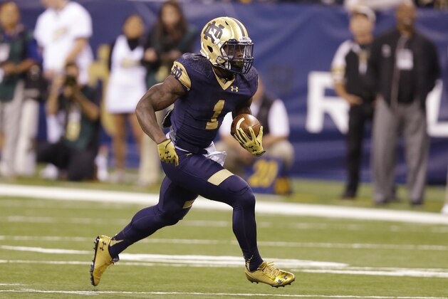 In this Sept. 13, 2014, photo, Notre Dame running back Greg Bryant  runs against Purdue during the first half of an NCAA college football game in Indianapolis. While he is fourth on the team in carries, Bryant leads the eighth-ranked Irish in rushing with 119 yards, averaging 5.4 yards a carry. (AP Photo/Michael Conroy)