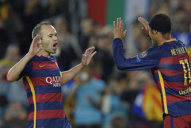 Barcelona's Brazilian forward Neymar (R) celebrates with Barcelona's midfielder Andres Iniesta (L) after scoring a goal during the UEFA Champions League group E football match FC Barcelona vs FC BATE Borisov at the Camp Nou stadium in Barcelona on November 4, 2015. AFP PHOTO/ LLUIS GENE        (Photo credit should read LLUIS GENE/AFP/Getty Images)