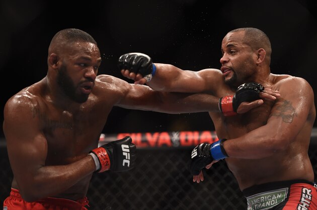 LAS VEGAS, NV - JANUARY 03:  Jon Jones (L) and Daniel Cormier (R) exchange punches in their UFC light heavyweight championship bout during the UFC 182 event at the MGM Grand Garden Arena on January 3, 2015 in Las Vegas, Nevada.  (Photo by Jeff Bottari/Zuffa LLC/Zuffa LLC via Getty Images)
