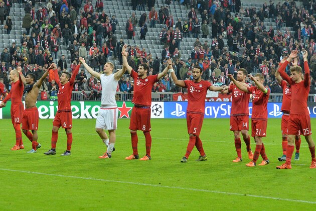 Munich's players celebrate to the supporters after their Champions League Group F soccer match between Bayern Munich and Arsenal FC in Munich, southern Germany, Wednesday, Nov. 4, 2015. Munich won 5-1. (AP Photo/Kerstin Joensson)