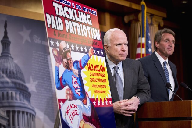Sen. John McCain, R-Ariz., left, and Sen. Jeff Flake, R-Ariz., talk to reporters about “paid patriotism” during a news conference on Capitol Hill in Washington, Wednesday, Nov. 4, 2015.The senator discussed a report on 'patriotism for profit' practices at pro sporting events, detailing 'widespread evidence of the Defense Department paying professional sports teams and leagues such as the NFL, MLB, and NHL to honor American soldiers at sporting events. (AP Photo/Manuel Balce Ceneta)
