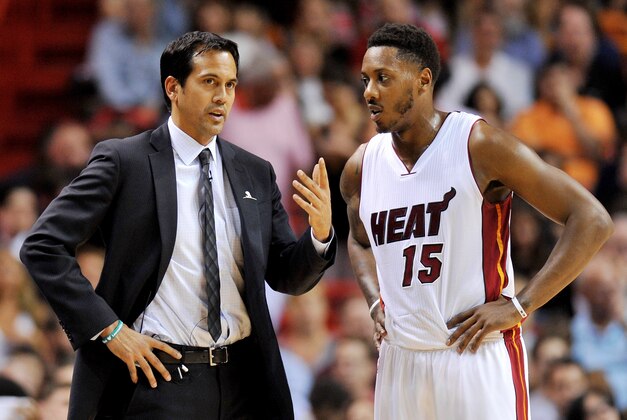 Apr 9, 2015; Miami, FL, USA; Miami Heat head coach Erik Spoelstra (left) talks with guard Mario Chalmers (right) during the first half against the Chicago Bulls at American Airlines Arena. Mandatory Credit: Steve Mitchell-USA TODAY Sports