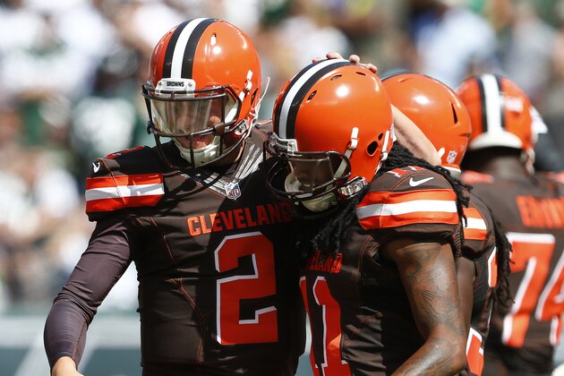 EAST RUTHERFORD, NJ - SEPTEMBER 13: Quarterback Johnny Manziel #2 of the Cleveland Browns pats Travis Benjamin #11 on the head after Benjamin caught a touchdown pass during the second quarter of a game at MetLife Stadium on September 13, 2015 in East Rutherford, New Jersey. The Jets won 31-10. (Photo by Rich Schultz /Getty Images) EAST RUTHERFORD, NJ - SEPTEMBER 13: Quarterback Johnny Manziel #2 of the Cleveland Browns pats Travis Benjamin #11 on the head after Benjamin caught a touchdown pass during the second quarter of a game at MetLife Stadium on September 13, 2015 in East Rutherford, New Jersey. The Jets won 31-10. (Photo by Rich Schultz /Getty Images)