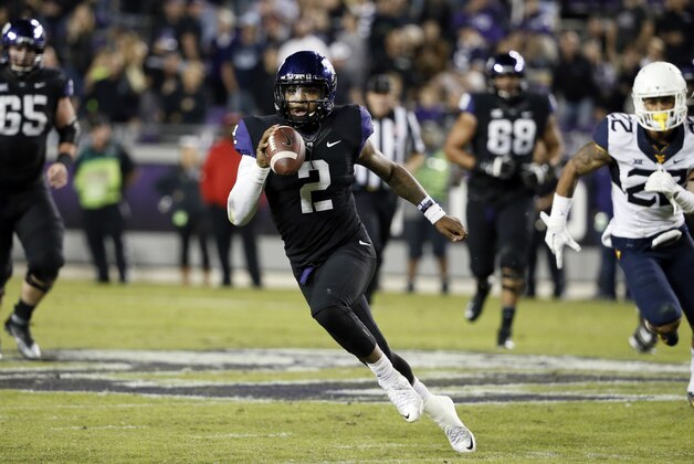 TCU quarterback Trevone Boykin (2) scrambles out of the pocket and keeps the ball for a long run from the line of scrimmage as West Virginia safety Jarrod Harper (22) gives chase in the second half of an NCAA college football game Thursday, Oct. 29, 2015, in Fort Worth, Texas. (AP Photo/Tony Gutierrez)