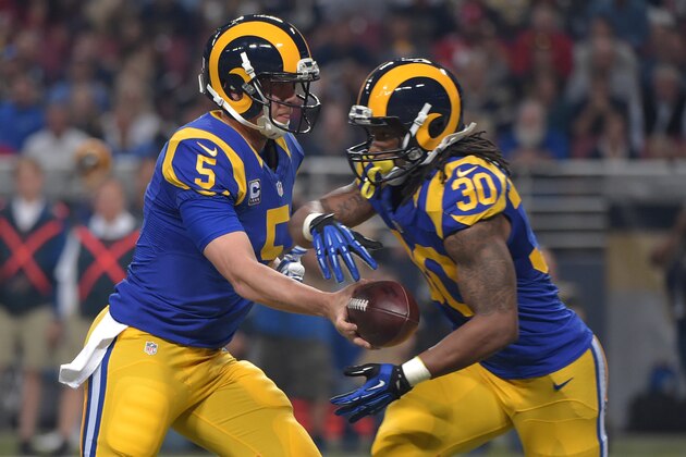 Nov 1, 2015; St. Louis, MO, USA; St. Louis Rams quarterback Nick Foles (5) hands off to running back Todd Gurley (30) during the first half against the San Francisco 49ers at the Edward Jones Dome. Mandatory Credit: Denny Medley-USA TODAY Sports