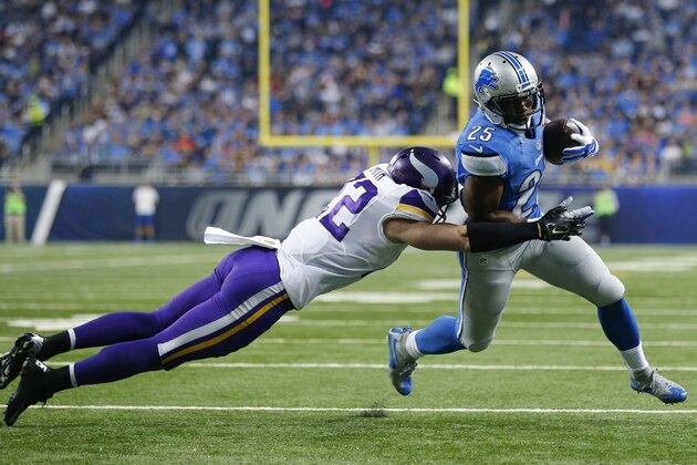 Detroit Lions running back Theo Riddick (25) tries pulling away from Minnesota Vikings free safety Harrison Smith (22) during the first half of an NFL football game, Sunday, Oct. 25, 2015, in Detroit. (AP Photo/Rick Osentoski) Detroit Lions running back Theo Riddick (25) tries pulling away from Minnesota Vikings free safety Harrison Smith (22) during the first half of an NFL football game, Sunday, Oct. 25, 2015, in Detroit. (AP Photo/Rick Osentoski)