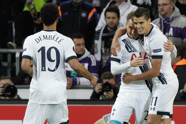 Tottenham's Christian Eriksen, center, celebrates with teammates after scoring a goal during the Europa League Group J soccer match between Tottenham and Anderlecht at Constant Vanden Stock stadium in Brussels, on Thursday Oct 22, 2015. (AP Photo/Francois Walschaerts)