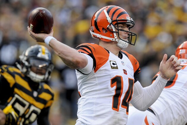 Cincinnati Bengals quarterback Andy Dalton (14) passes in the fourth quarter as Pittsburgh Steelers inside linebacker Ryan Shazier (50) pressure in an NFL football game, Sunday, Nov. 1, 2015 in Pittsburgh. (AP Photo/Don Wright)