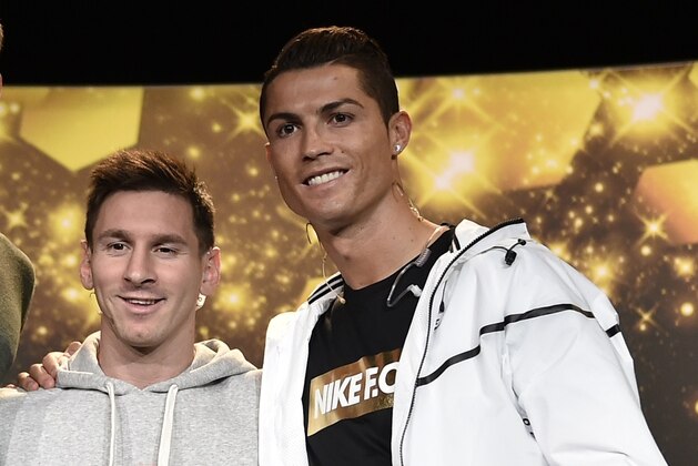 (From L) Bayern Munich and Germany goalkeeper  Manuel Neuer, Barcelona and Argentina forward Lionel Messi and Real Madrid and Portugal forward Cristiano Ronaldo pose during a press conference ahead of the  2014 FIFA Ballon d'Or award ceremony at the Kongresshaus in Zurich on January 12, 2015. AFP PHOTO / FABRICE COFFRINI        (Photo credit should read FABRICE COFFRINI/AFP/Getty Images)