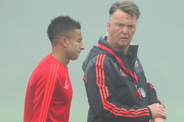 MANCHESTER, ENGLAND - NOVEMBER 02:  Louis van Gaal the manager of Manchester United talks with Jesse Lingard prior to a Manchester United training session on the eve of the UEFA Champions League Group B match against CSKA Moscow at Aon Training Complex on November 2, 2015 in Manchester, England.  (Photo by Alex Livesey/Getty Images)